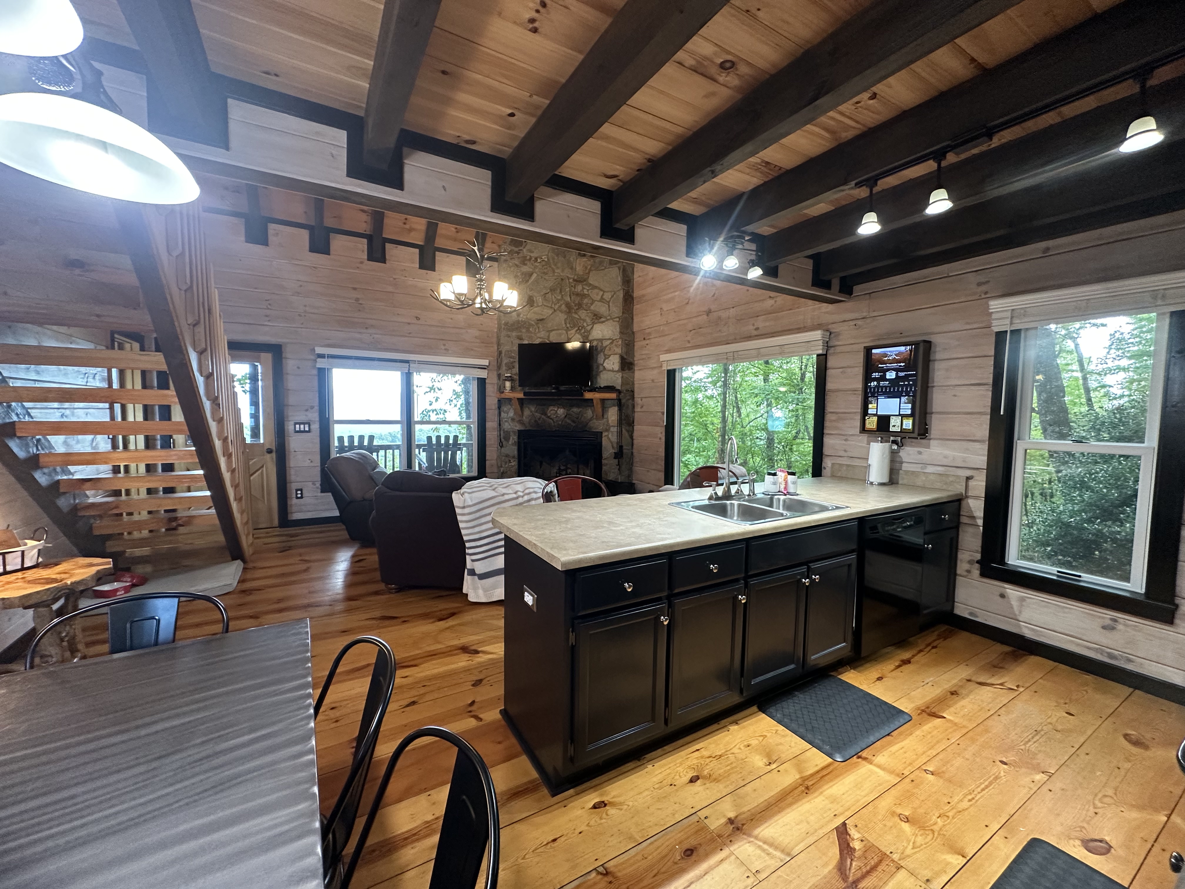 Bar seating, full kitchen, and easy access to the dining table and living area.